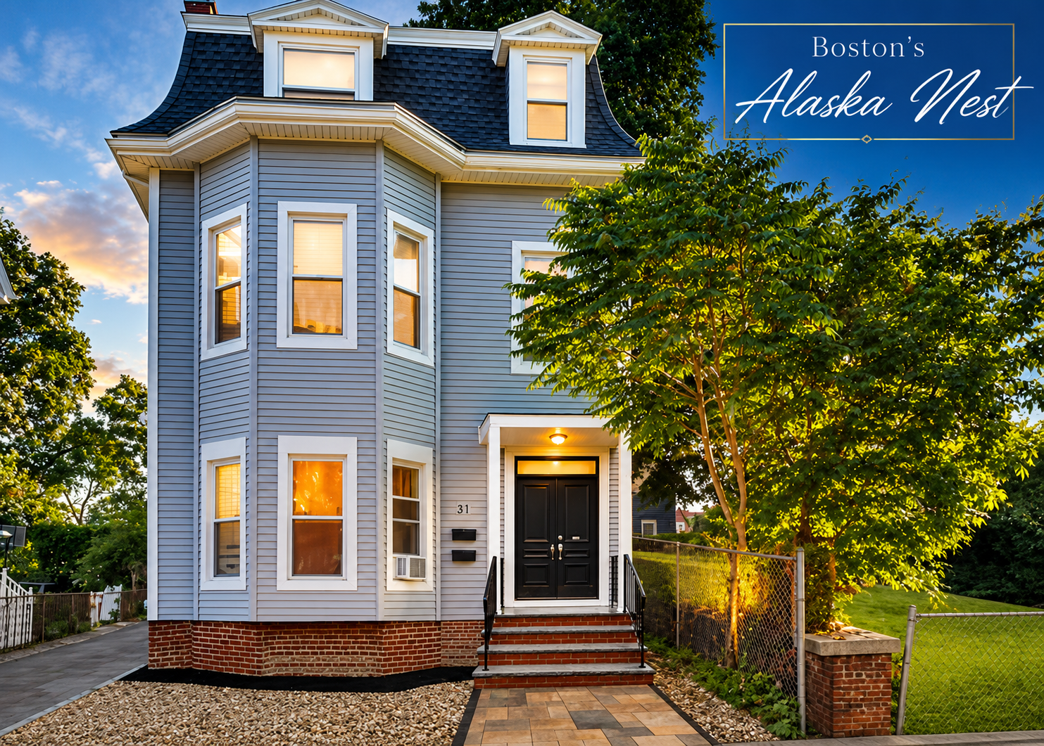 Alaska Nest house exterior at dusk with warm lit windows